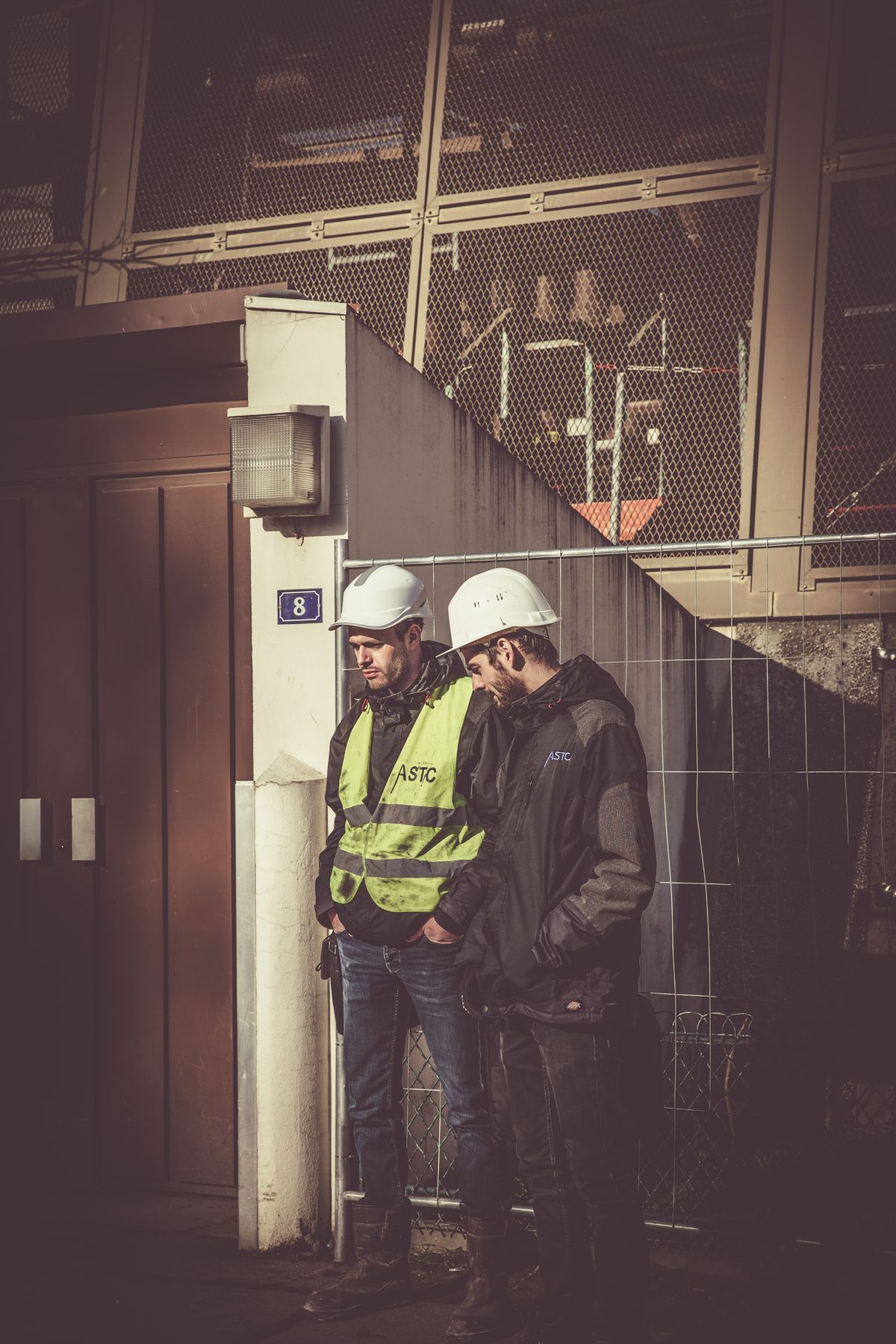 Two tradespeople reviewing work on site
